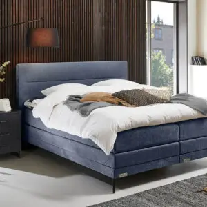 Boxspring Caresse 6850 in grijze stof met hoofdbord en matras, tweepersoonsformaat, geschikt voor diverse afmetingen.