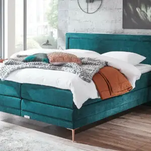 Boxspring Caresse 6950 in grijze stof, tweepersoons, met hoofdbord en matras, beschikbaar in diverse afmetingen.