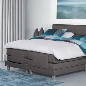 Elektrische Caresse Boxspring 9500 in grijze stof met verstelbare hoofd- en voeteneinden, maat 180x200 cm, inclusief matrasse