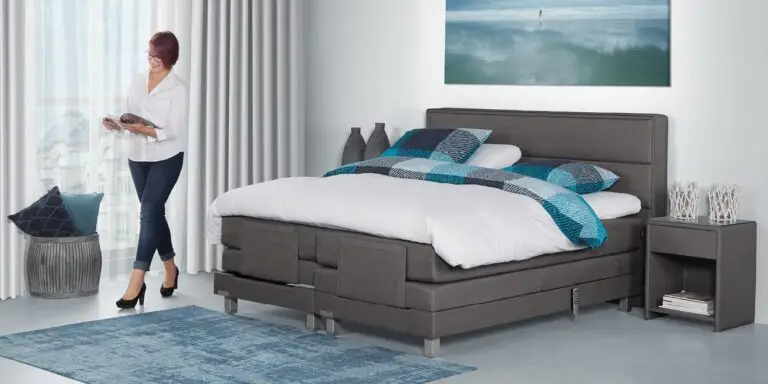 Elektrische Caresse Boxspring 9500 in grijze stof met verstelbare hoofd- en voeteneinden, maat 180x200 cm, inclusief matrasse
